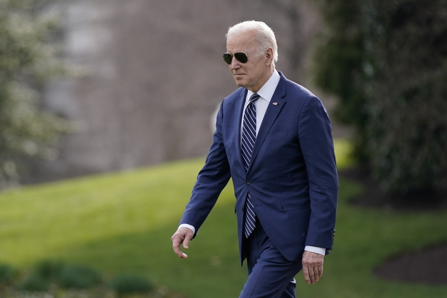 President Joe Biden walks on the South Lawn of the White House before boarding Marine One, Friday, March 18, 2022, in Washington. Biden is spending the weekend at his home in Rehoboth Beach, Del.