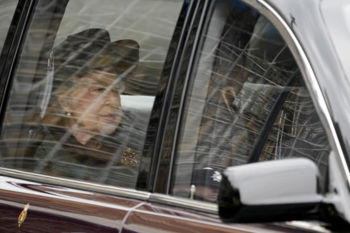 Britain's Queen Elizabeth II is driven in to attend a Service of Thanksgiving for the life of Prince Philip, Duke of Edinburgh at Westminster Abbey in London, Tuesday, March 29, 2022.