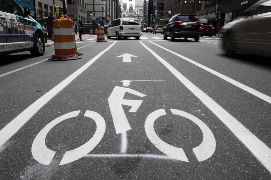 FILE - A bicycle lane along Market Street in Philadelphia, on June 4, 2018. The government has a fresh warning to states seeking billions of dollars from President Joe Biden's infrastructure law to widen roads: protect the safety of pedestrians and bicyclists or risk losing funds. In a new report submitted to Congress, the Transportation Department says it will now aim to prioritize the safety and health of all the users of a roadway, not just cars.