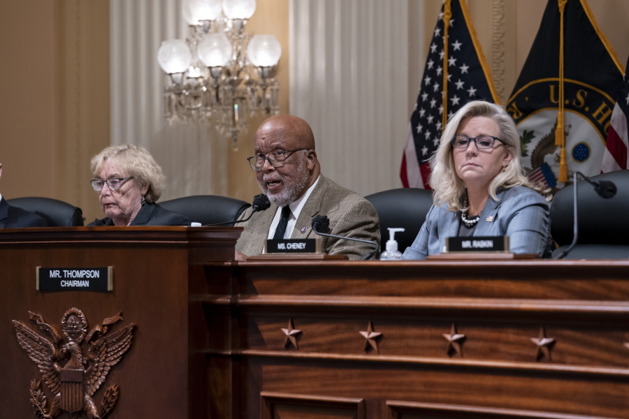 Chairman Bennie Thompson, D-Miss., center, flanked by Rep. Zoe Lofgren, D-Calif., left, and Vice Chair Liz Cheney, R-Wyo., makes a statement as the House committee investigating the Jan. 6 attack on the U.S. Capitol pushes ahead with contempt charges against former advisers to Donald Trump, Peter Navarro and Dan Scavino, in response to their refusal to comply with subpoenas, at the Capitol in Washington, Monday, March 28, 2022. Navarro, President Donald Trump's trade adviser, and Scavino, a White House communications aide under Trump, have been uncooperative in the congressional probe into the deadly 2021 insurrection. (AP Photo/J.
