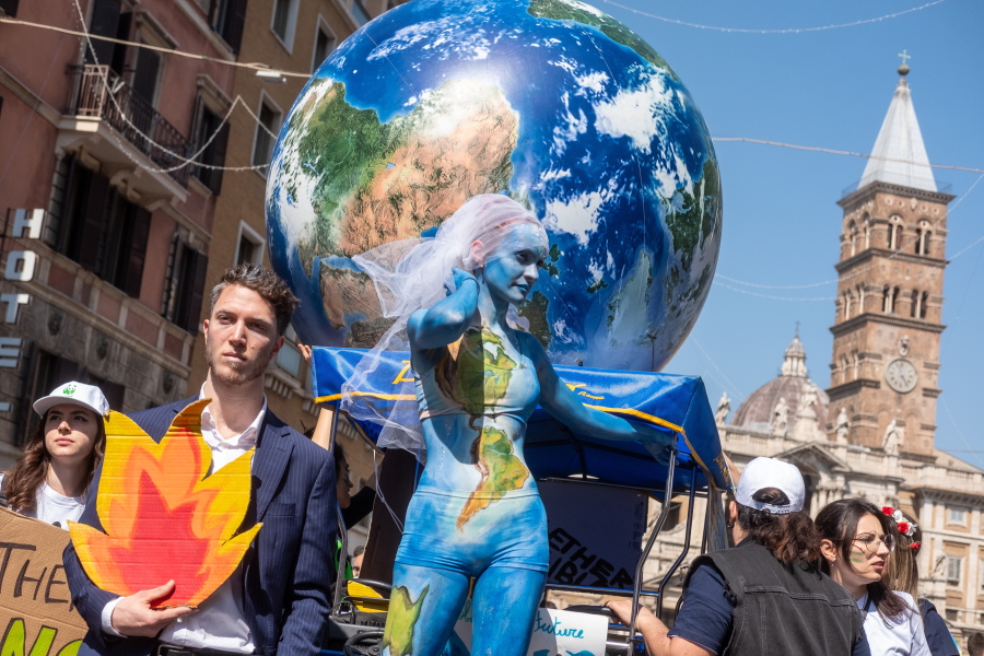 Demonstrators of the Fridays for Future movement march in downtown Rome, Friday, March 25, 2022. Climate activists staged a tenth series of worldwide protests Friday to demand leaders take stronger action against global warming, with some linking their environmental message to calls for an end to the war in Ukraine.
