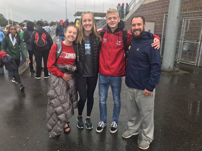 Owen Frasier poses with (from left) Fort Vancouver runners Emily Phelps, Anna Harrison and Drew Weber in 2019.