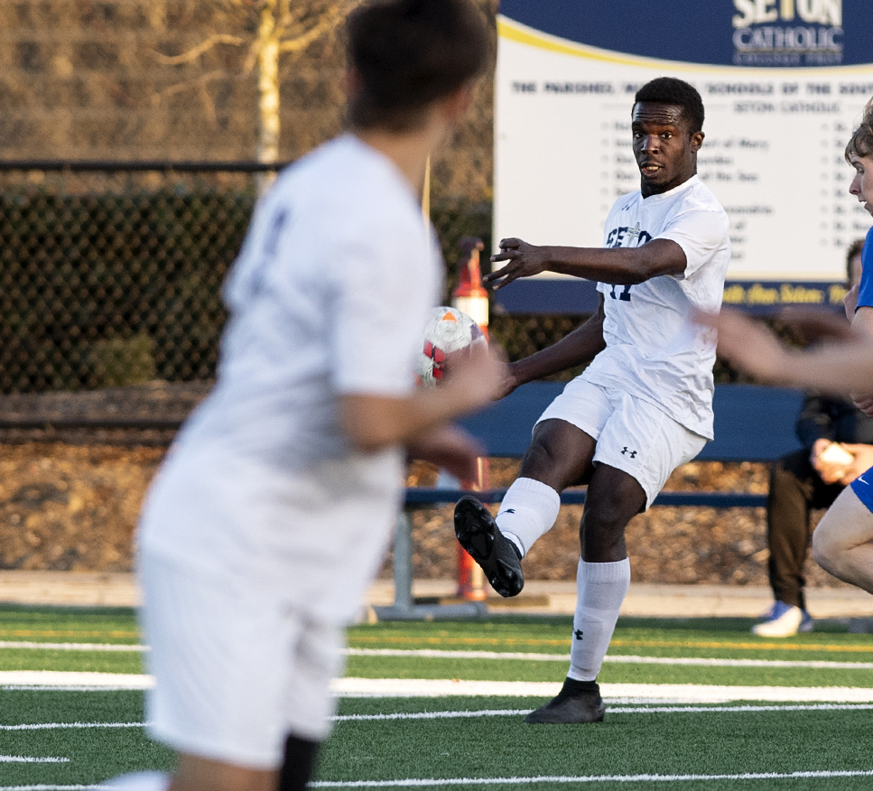 Seton Catholic’s David Moore threads the needle through the La Center defense with a long pass to a teammate on Tuesday, April 13, 2021, at Seton Catholic Preparatory School. The Cougars won 3-1 in the 1A Trico League game.