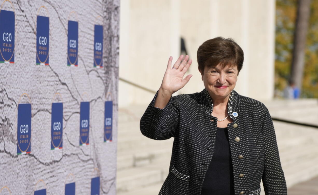 FILE - International Monetary Fund President Kristalina Georgieva waves as she arrives for a meeting of G20 finance and health ministers at the Salone delle Fontane (Hall of Fountains) in Rome, Oct. 29, 2021.