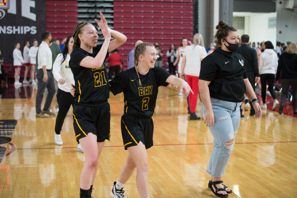 Hudson's Bay players Paytin Ballard, left, and Promise Bond celebrate after a 54-53 win over West Valley of Spokane at the Class 2A girls basketball state tournament on Friday, March 4, 2022 in Yakima (Micah Rice/The Columbian)