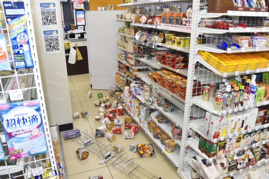 Products are scattered at a convenience store in Fukushima, northern Japan Wednesday, March 16, 2022, following an earthquake. A powerful earthquake shook off the coast of Fukushima in northern Japan on Wednesday, triggering a tsunami advisory.