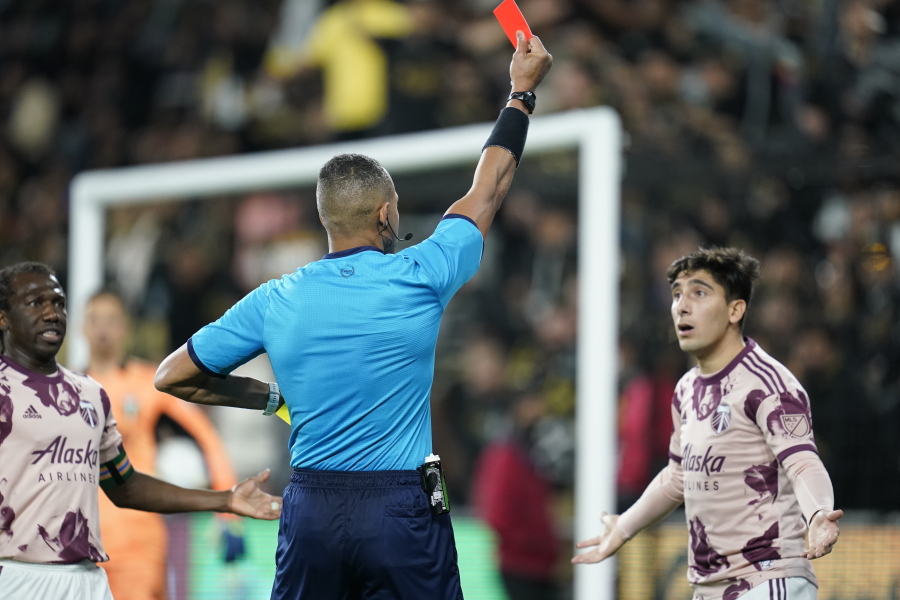 Portland Timbers defender Claudio Bravo, right, is given a red card during the second half of an MLS soccer match against the Los Angeles FC in Los Angeles, Sunday, March 6, 2022.