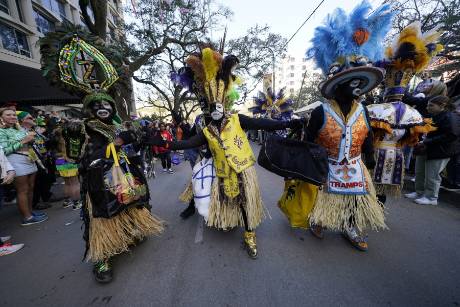Members of the Zulu Tramps dance at the Krewe of Zulu parade during Mardi Gras on Tuesday, March 1, 2022, in New Orleans.