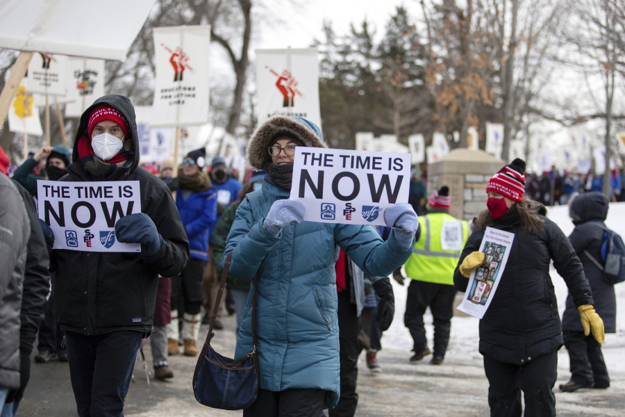 Twin Cities teachers and their supporters brave sub-zero temperatures Saturday, Feb. 12, 2022, to march in Minneapolis.