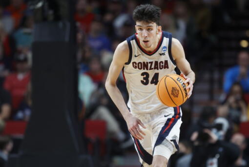 Gonzaga center Chet Holmgren (34) moves the ball against Georgia State during the second half of a first round NCAA college basketball tournament game, Thursday, March 17, 2022, in Portland, Ore. (AP Photo/Craig Mitchelldyer)