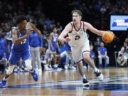 Gonzaga forward Drew Timme (2) drives past Memphis forward DeAndre Williams (12) during the second half of a second-round NCAA college basketball tournament game, Saturday, March 19, 2022, in Portland, Ore.