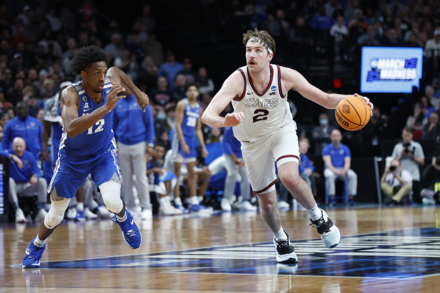 Gonzaga forward Drew Timme (2) drives past Memphis forward DeAndre Williams (12) during the second half of a second-round NCAA college basketball tournament game, Saturday, March 19, 2022, in Portland, Ore.