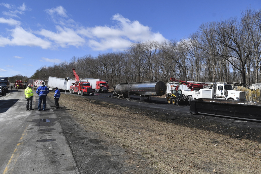 Semi trucks are strewn about I-81 north in Foster Township after Monday's deadly multi-vehicle crash on both I-81 northbound lanes on Tuesday, March 29, 2022, in Schuylkill County, Pa.