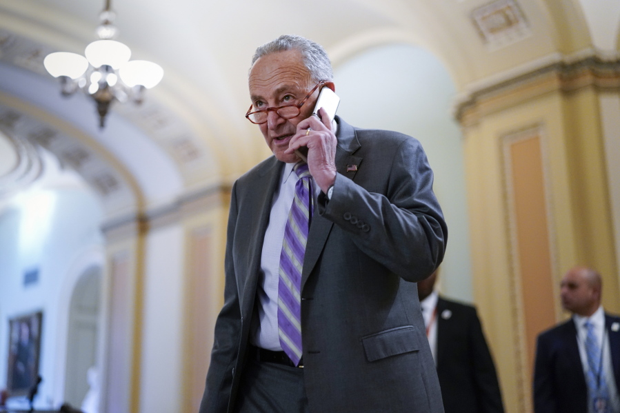 Senate Majority Leader Chuck Schumer, D-N.Y., arrives for a weekly policy luncheon, at the Capitol in Washington, Tuesday, March 8, 2022. (AP Photo/J.