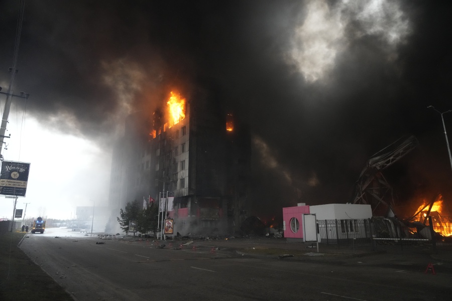 A building burns after shelling in Kyiv, Ukraine, Thursday, March 3, 2022. Russia has launched a wide-ranging attack on Ukraine, hitting cities and bases with airstrikes or shelling.