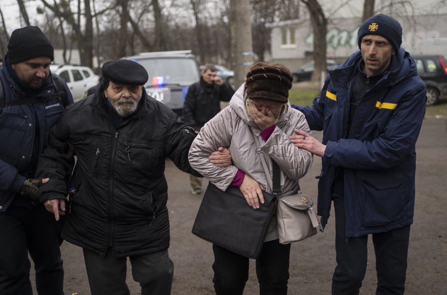 Residents evacuated from Irpin arrive at an assistance center on the outskirts of Kyiv, Ukraine, Wednesday, March 30, 2022.