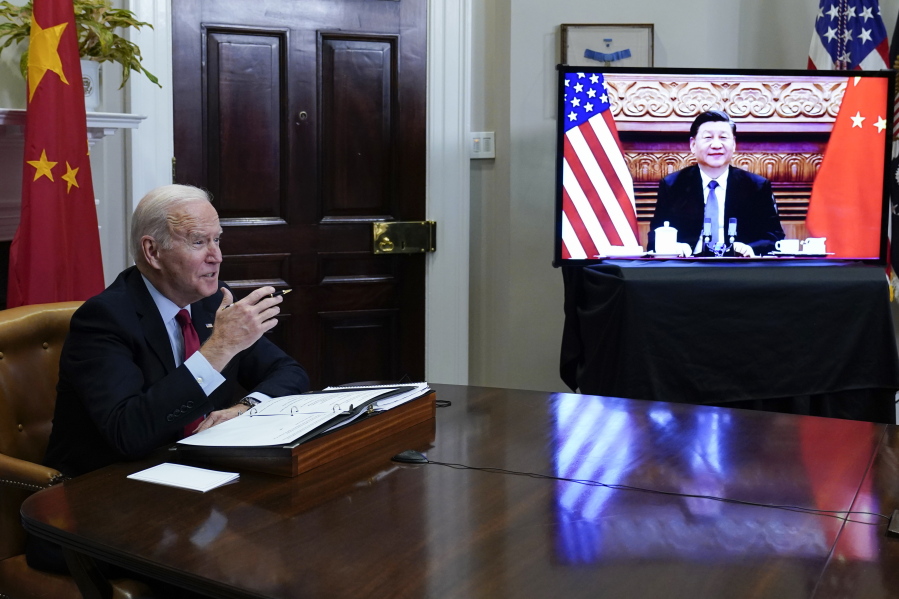 FILE - President Joe Biden meets virtually with Chinese President Xi Jinping from the Roosevelt Room of the White House in Washington, on Nov. 15, 2021. Biden set out to be the U.S. president who finally completed the "Asia pivot," Washington lingo for a long sought adjustment of U.S. foreign policy to better reflect the rise of America's most significant competitor: China.