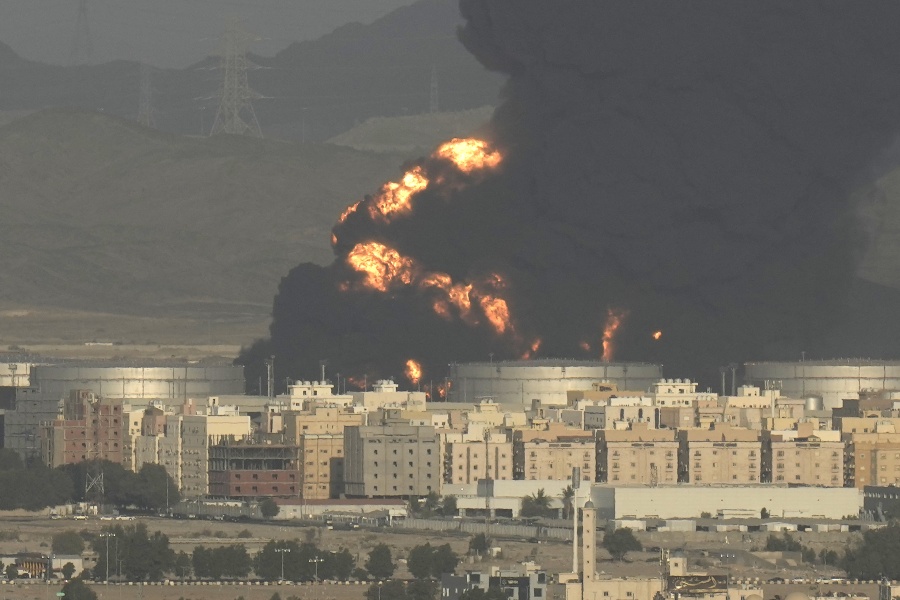 A cloud of smoke rises from a burning oil depot in Jiddah, Saudi Arabia, Friday, March 25, 2022.