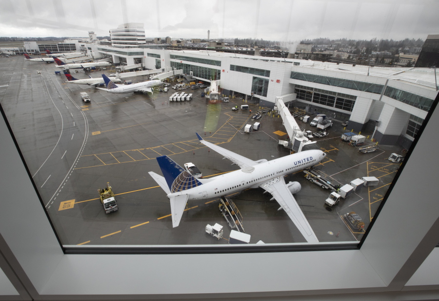 The view from inside the 780 foot-long, 85 foot-high aerial passenger walkway, part of the new International Arrivals Facility at Sea-Tac International Airport, Thursday, March 3, 2022, in Seattle (Ken Lambert/The Seattle Times via AP)