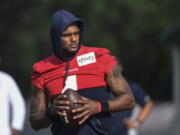 FILE - Texans quarterback Deshaun Watson (4) practices with the team during NFL football practice Monday, Aug. 2, 2021, in Houston. A judge has declined efforts by attorneys for Houston Texans quarterback Deshaun Watson to delay all his depositions in connection with lawsuits filed by 22 women who have accused him of sexual assault and harassment. During a court hearing Monday, Feb. 21, 2022, defense attorney Rusty Hardin asked that depositions be delayed until the end of a criminal investigation.