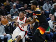 Portland Trail Blazers guard Ben McLemore (23) drives around Utah Jazz guard Donovan Mitchell (45) during the first half of an NBA basketball game Wednesday, March 9, 2022, in Salt Lake City.