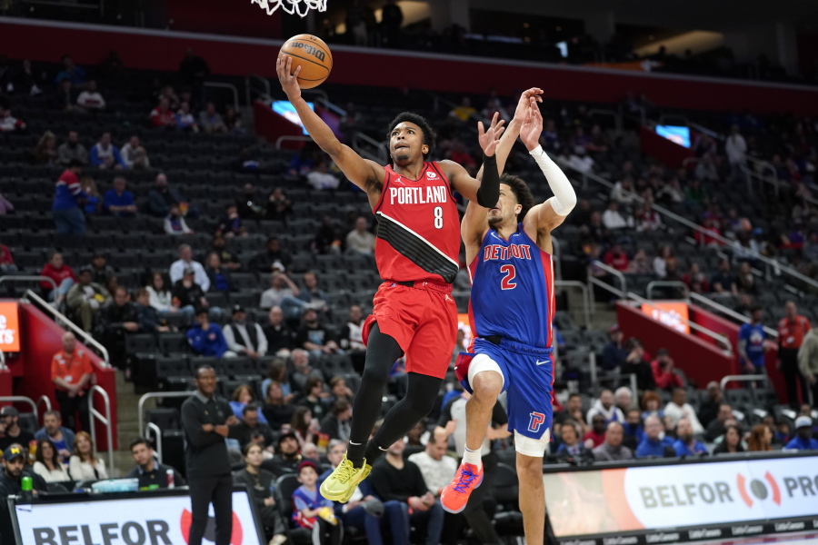 Portland Trail Blazers guard Brandon Williams (8) drives on Detroit Pistons guard Cade Cunningham (2) in the second half of an NBA basketball game in Detroit, Monday, March 21, 2022.