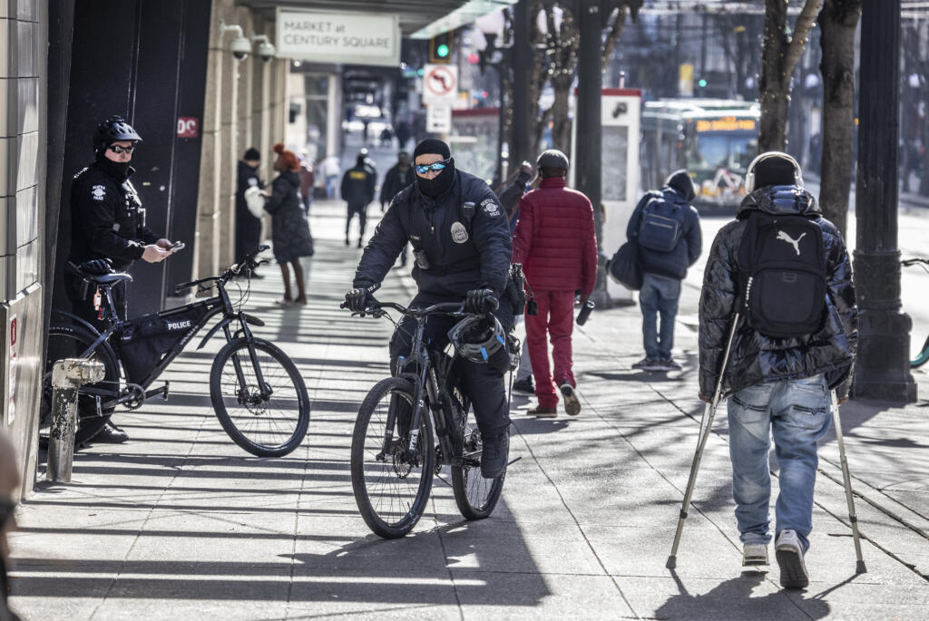 As part of "Operation New Day," more Seattle Police officers are patrolling down 3rd Avenue near Pine Street in downtown Seattle, Thursday, March 10, 2022.