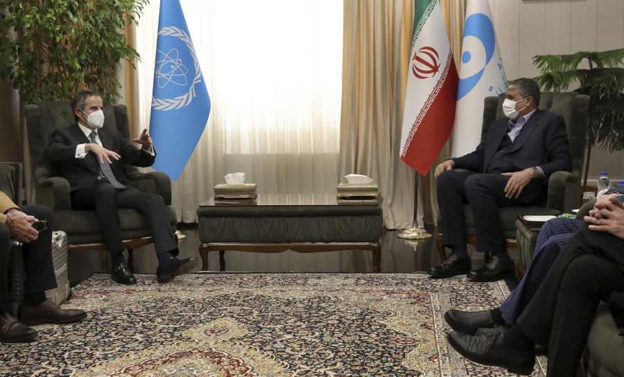 FILE - International Atomic Energy Organization, IAEA, Director General Rafael Mariano Grossi, left, speaks with Head of Atomic Energy Organization of Iran Mohammad Eslami during their meeting in Tehran, on March 5, 2022. As the war in Ukraine rages on, diplomats trying to salvage the languishing 2015 Iran nuclear deal have been forging ahead with negotiations despite distractions caused by the conflict.