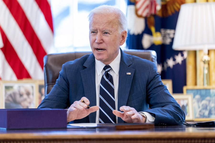 FILE - President Joe Biden speaks before signing the American Rescue Plan, a coronavirus relief package, in the Oval Office of the White House, March 11, 2021, in Washington.It's been one year since President Joe Biden signed into law the American Rescue Plan. The $1.9 trillion package of relief measures was designed to fight the coronavirus pandemic and help the economy rebound.