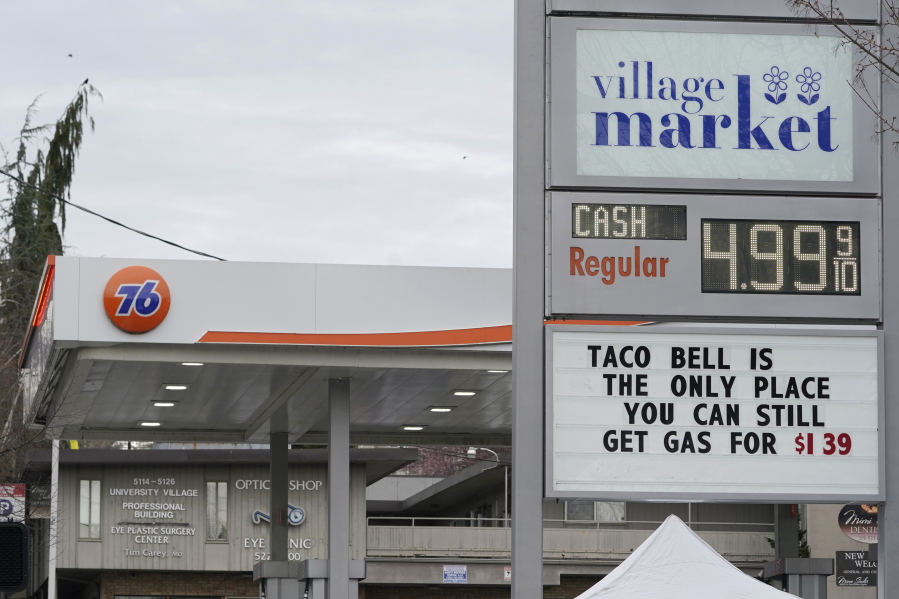 A sign at a gas station near the University of Washington makes a humorous statement about rising gas prices Friday in Seattle. (TED S.