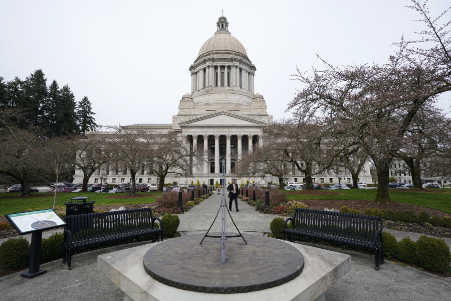 The sun dial near the Legislative Building is shown under cloudy skies, Thursda at the Capitol in Olympia. (Ted S.