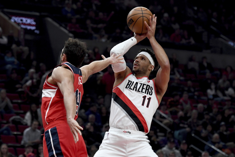 Blazers guard Josh Hart shoots over the Wizards' Raul Neto during the Portland's win. Hart finished with a career-high 44 points as the Blazers ended a six-game losing streak.