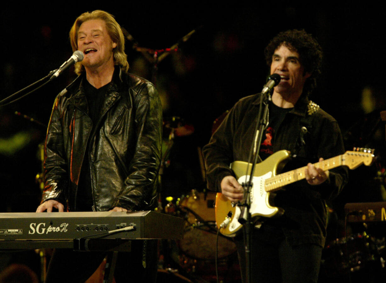 Daryl Hall and John Oates play one of their songs during the Saturday night session of the NBA All-Star Weekend at the First Union Center in Philadelphia, Pennsylvania on Feb. 9, 2002.