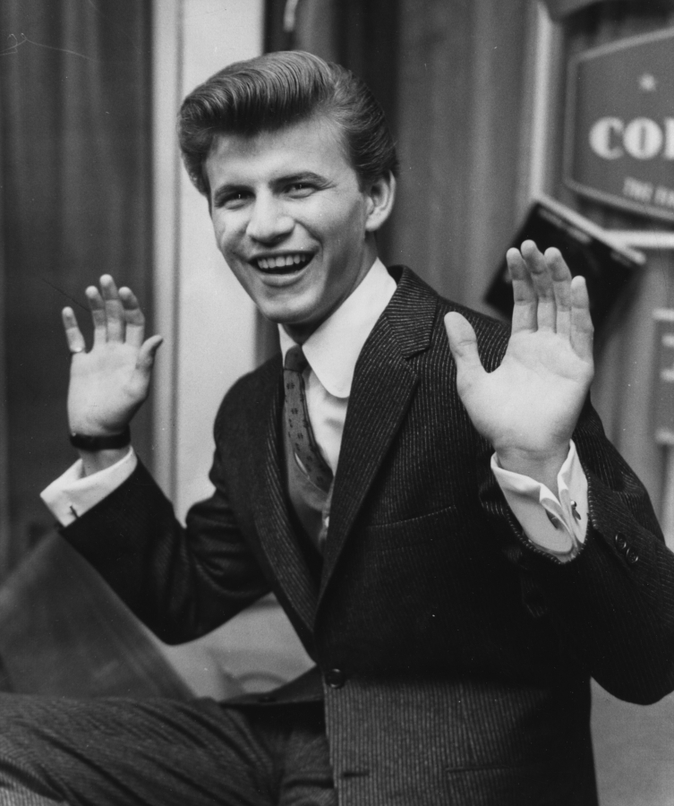 Portrait of American singer Bobby Rydell, pictured laughing and raising his hands in the air, at a press reception for his appearance on the television show "Sunday Night at the London Palladium," London, Feb. 17 1961. Rydell died Tuesday, April 5, 2022. He was 79.