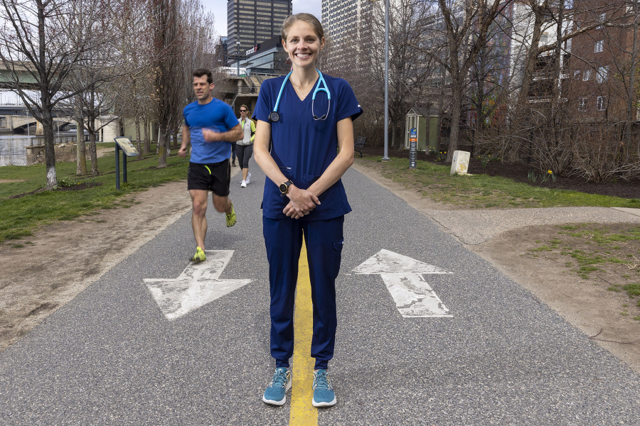 Penn nurse Sam Roecker is running the Boston Marathon in nursing scrubs, raising funds to support nurses' mental health and wellbeing. She sometimes trains on the Schuylkill River Trail, logging up to 100 miles a week. (Alejandro A.