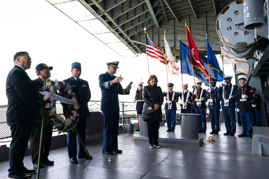 US Coast Guard Chaplain Captain Santiago Rodriguez delivers a benediction on the fantail of the USS Hornet during the 80th Anniversary Remembrance of the Bataan Death March on the USS Hornet in Alameda, CA on Sunday, April 10, 2022.