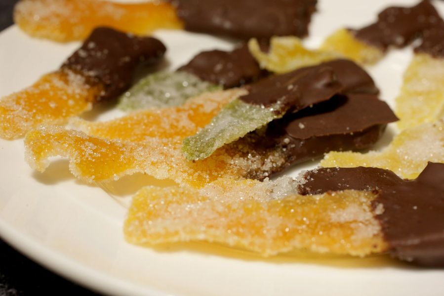 Candied Citrus Fruit Peels dipped in chocolate, Wednesday, March 23, 2022. (Hillary Levin/St.
