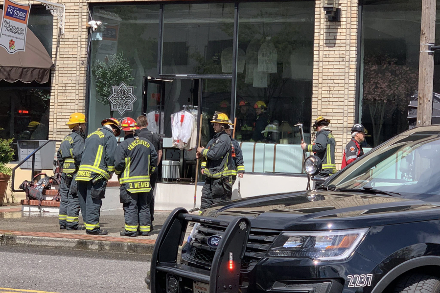 Vancouver firefighters meet after extinguishing a fire Thursday afternoon at Diosa, a new downtown Vancouver Mexican restaurant that was scheduled to open Tuesday. Owner Jorge Castro said a decoration caught fire while they were doing a photo shoot and training in the restaurant.
