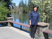 Camas Parks and Recreation Director Trang Lam stands outside the city-owned Lacamas Lake Lodge, overlooking Lacamas Lake, on Monday, April 12, 2021.