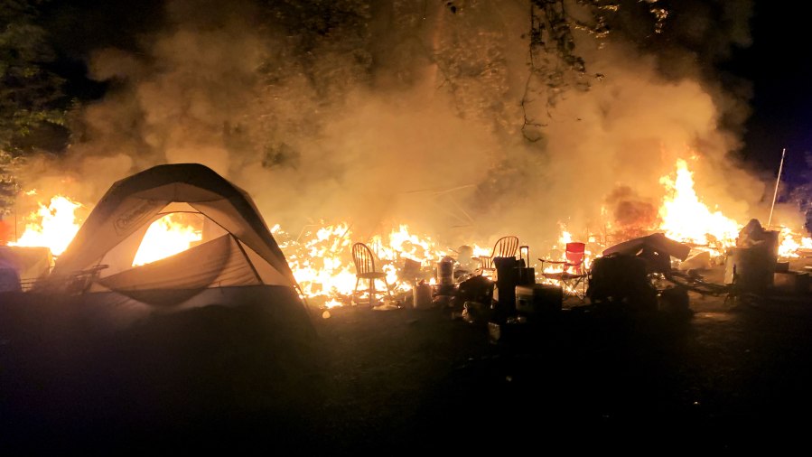A fire destroyed a tent and other possessions at a homeless camp in east Vancouver in May 2021.