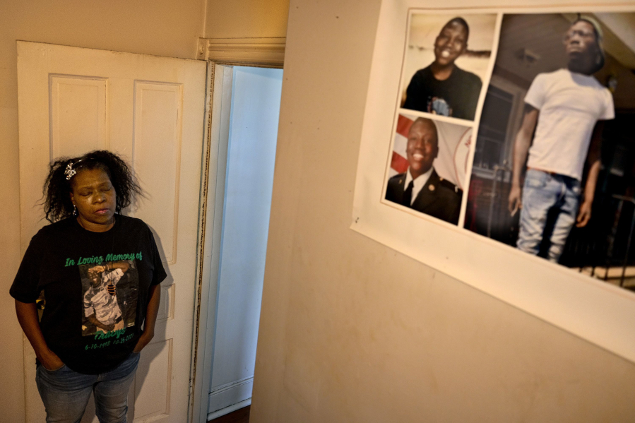 Tysha Melton visits a memorial to her dead son, Travys Taylor, in his old room in her home. In March, she said, a dozen law enforcement officers raided her home, looking to arrest Taylor on a bench warrant for criminal trespass.