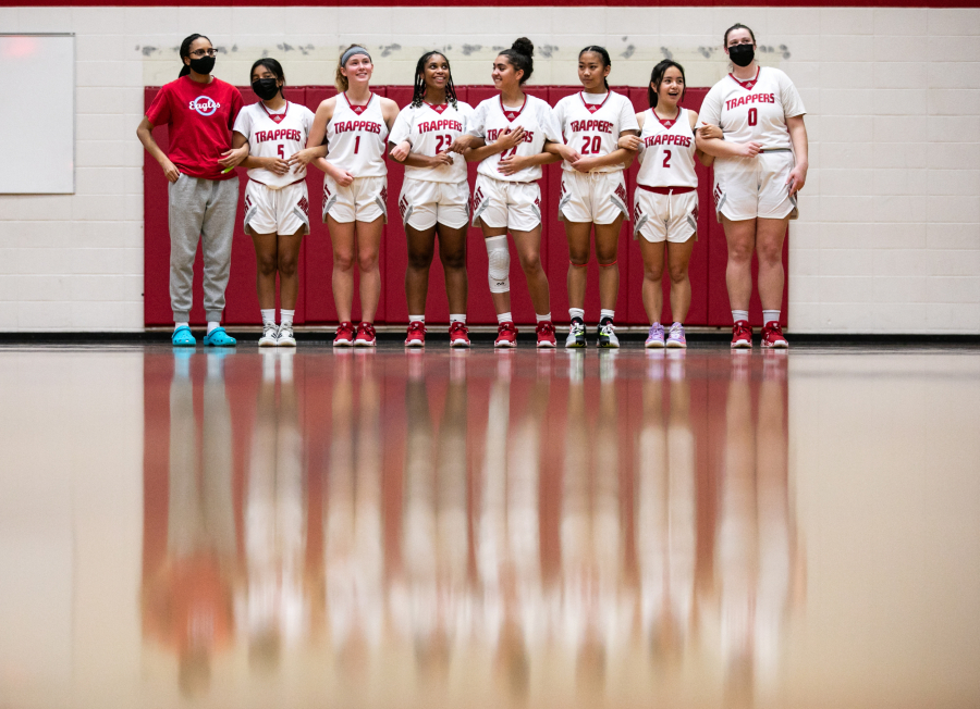 Members of the Fort Vancouver girls varsity team stand for the national anthem before their game against Columbia Adventist Academy at Fort Vancouver High School on Saturday, December 11, 2021.