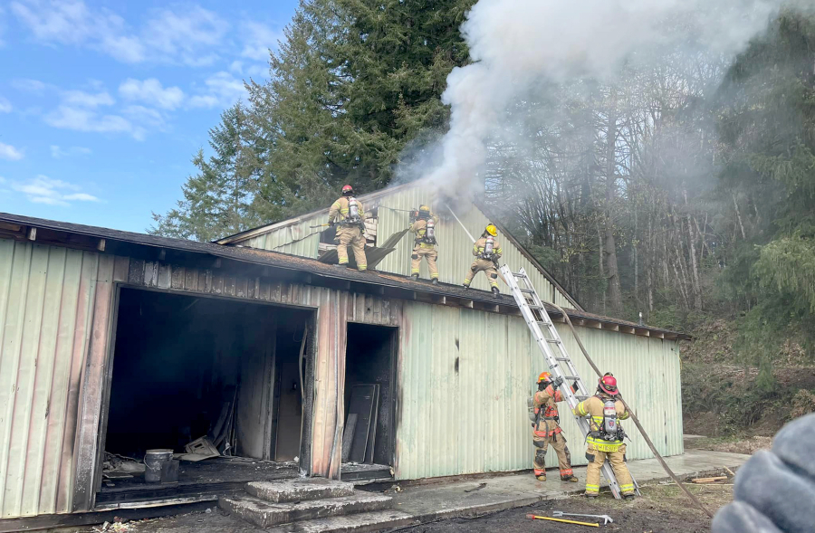 A commercial building caught fire Friday afternoon in Woodland. Arriving fire crews found a man dead outside whom the Clark County Fire Marshal's Office said was thrown from the building in an explosion.