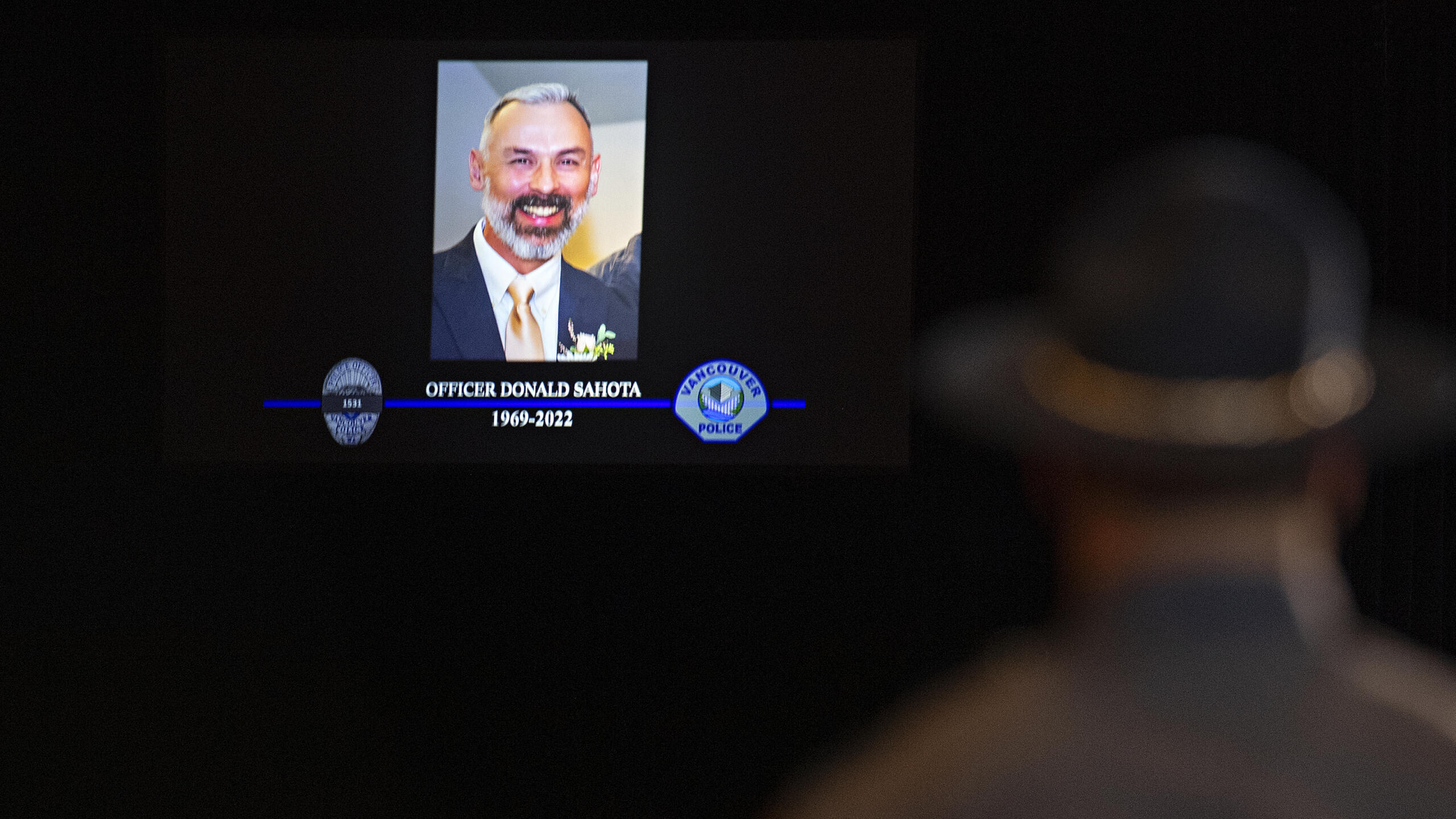 Law enforcement officials pay tribute to Officer Donal Sahota during a memorial service at ilani Casino Resort near La Center on Tuesday afternoon, Feb. 8, 2022.