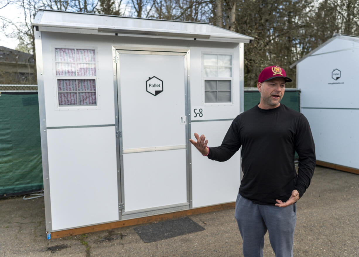 Michael Eddy shows the exterior of his Pallet home at the Stay Safe Community in the North Image neighborhood, located at 11400 N.E. 51st Circle in Vancouver. Eddy was planning to move into his own housing over the weekend.