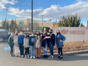 FAIRGROUNDS: Vancouver iTech Preparatory's Key Club visited the Clark County Food Bank on March 4 to hand over a $1,500 check.