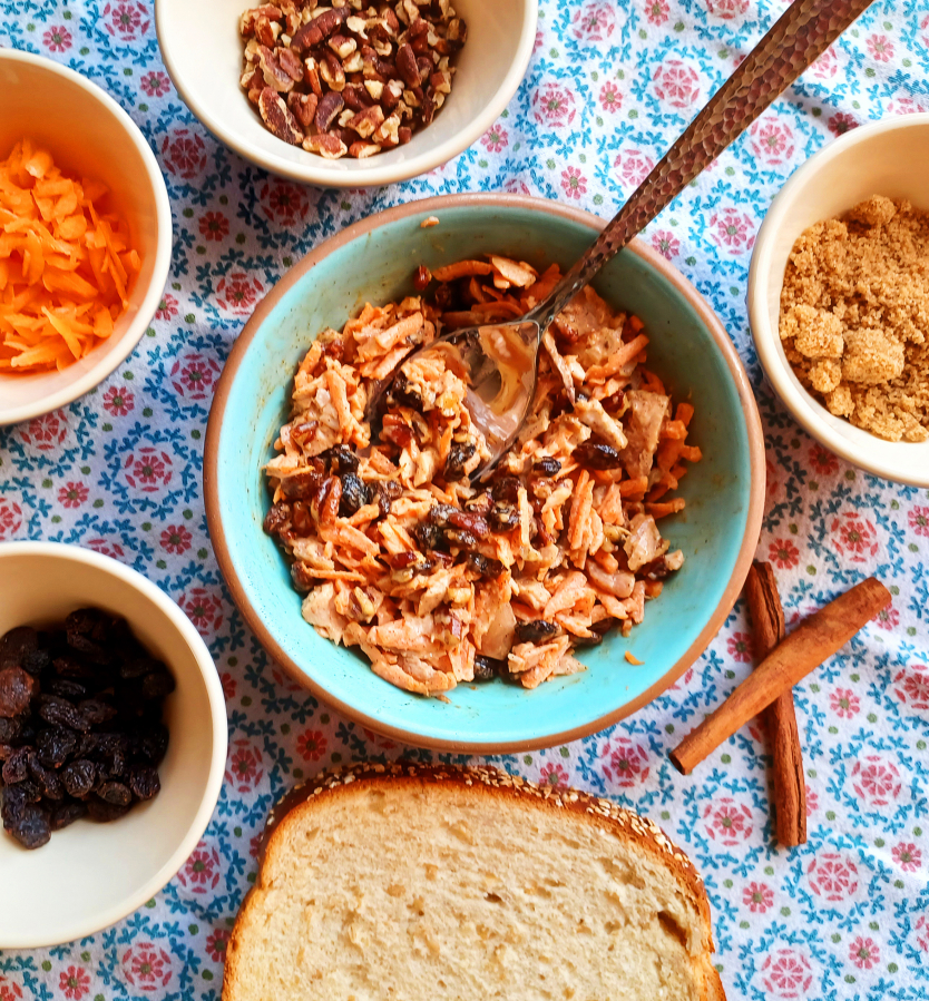 This chicken salad sandwich filling will get on your sweet side with carrots, raisins, pecans and spices.