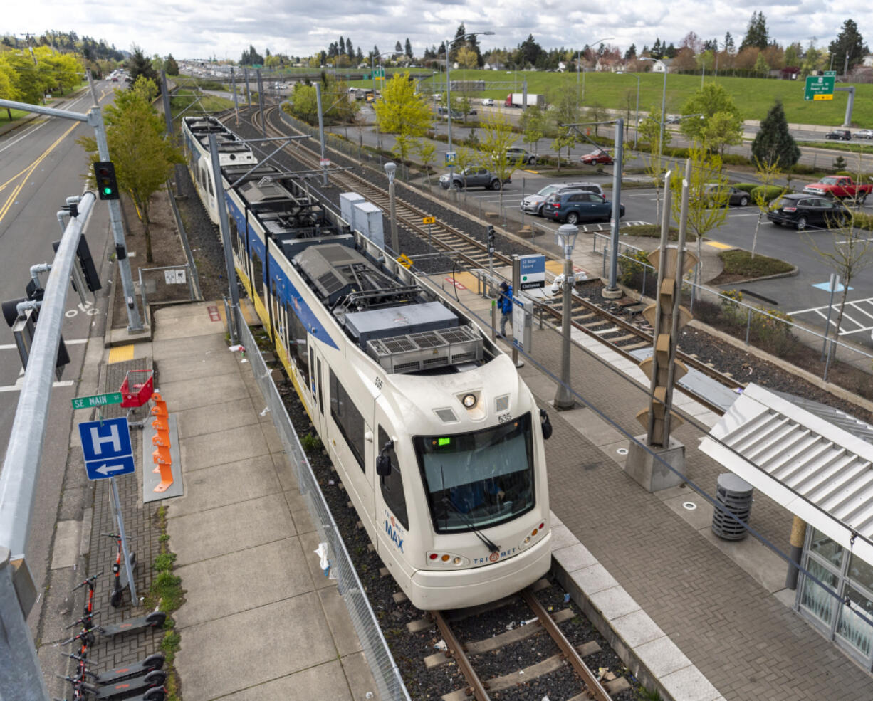 A MAX Green Line train pulls into the Southeast Main Street stop near Mall 205 in Portland. If light rail comes to Vancouver, a decision will need to be made about what security and law enforcement in the jurisdiction will look like on the MAX.