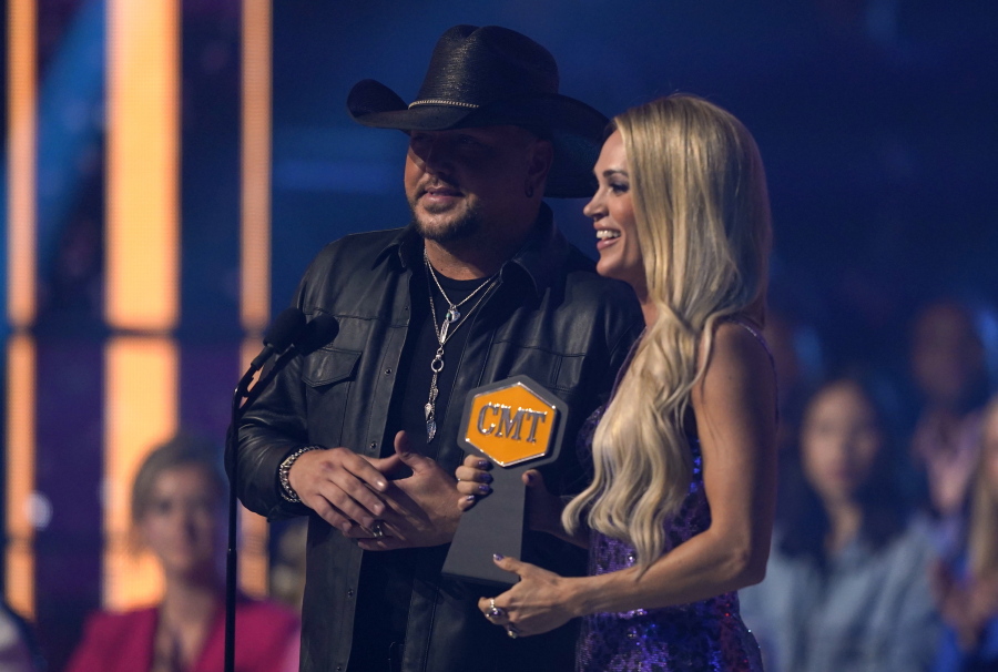 Jason Aldean, left, and Carrie Underwood accept the award for video of the year for "If I Didn't Love You" at the CMT Music Awards on Monday, April 11, 2022, at the Municipal Auditorium in Nashville, Tenn.