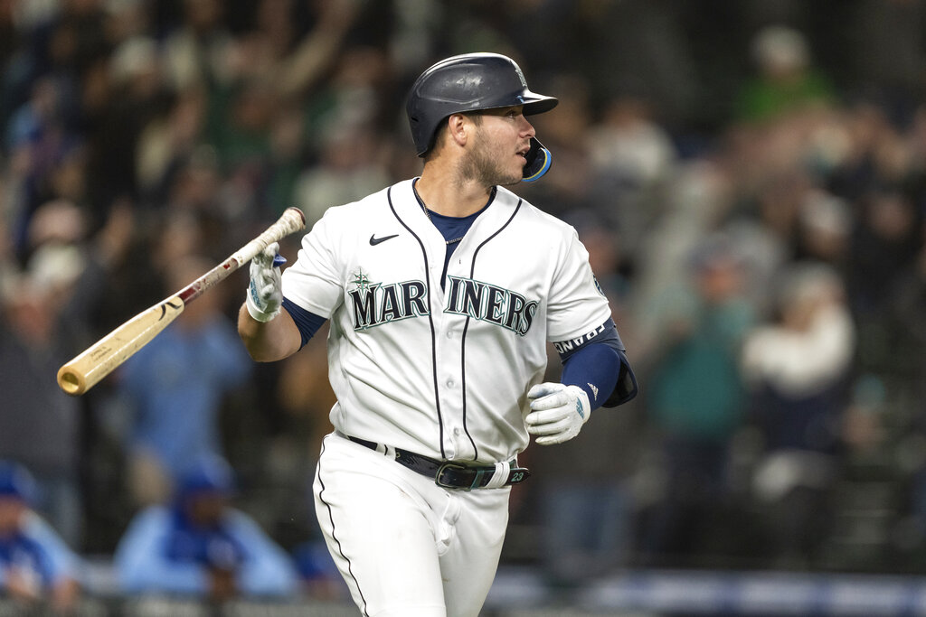 Seattle Mariners' Ty France flips his bat after hitting a three-run home run that scored Julio Rodriguez and Jesse Winker off of Kansas City Royals relief pitcher Dylan Coleman during the eighth inning of a baseball game, Saturday, April 23, 2022, in Seattle. The Mariners won 13-7.